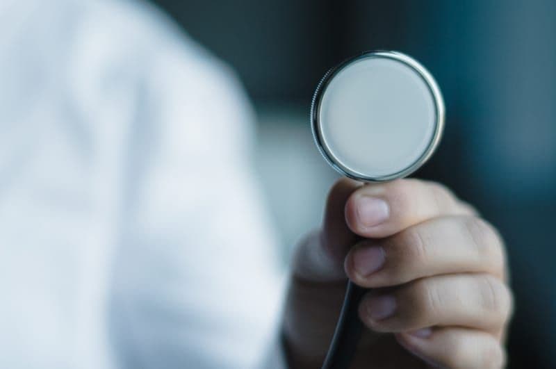 Stethoscope held up during an annual occupational medical