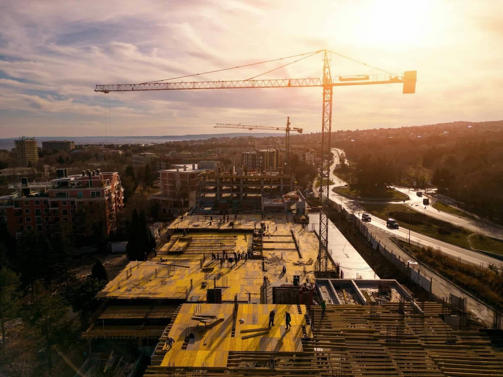 Aerial view of a construction site with a tower crane