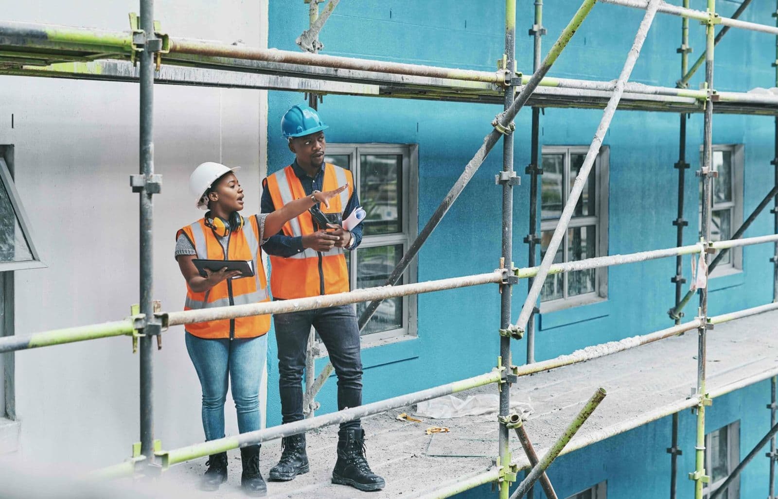 Construction contractors on scaffolding, the teams My Safety File builds safety files for