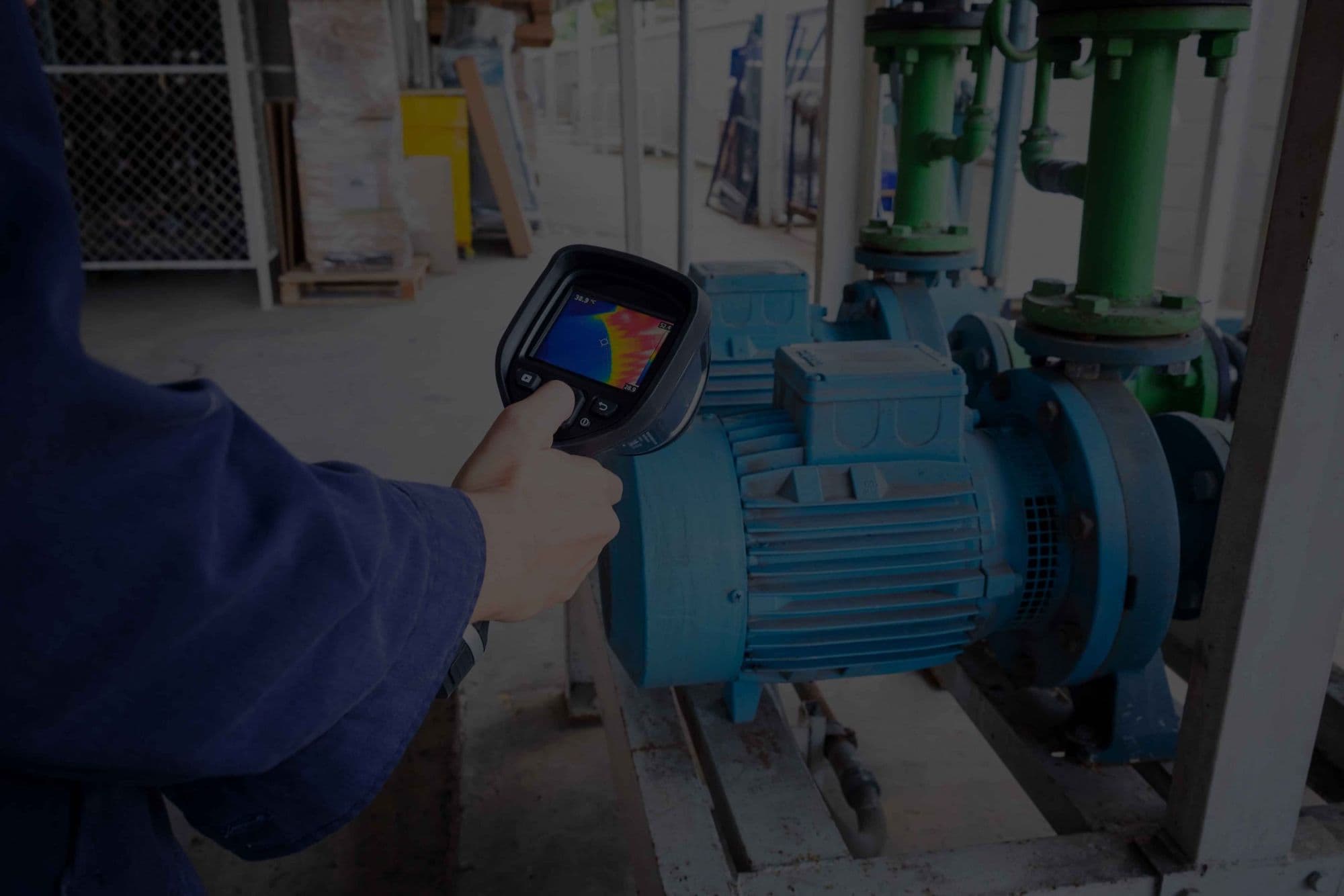 Thermal camera checking a pump motor for overheating bearings